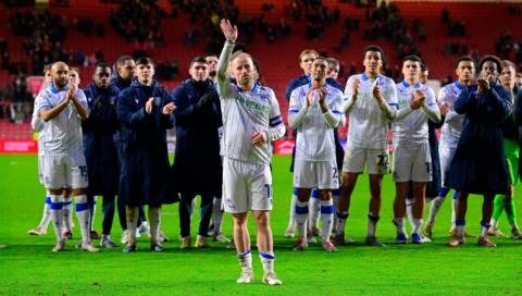 The Sheffield Wednesday squad applauds an emotional Barry Bannan as he waves goodbye to the travelling supporters after playing his final game for the club in a 2-0 defeat at Bristol City