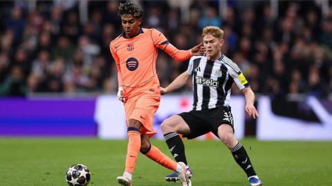 Lewis Hall closes Lamine Yamal down during Newcastle United's game against Barcelona at St James' Park on 10 March, 2026