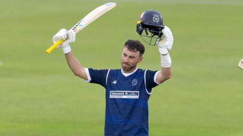 Joe Weatherley raising bat