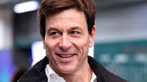 Mercedes team principal Toto Wolff smiling