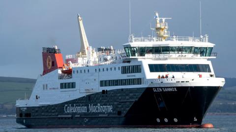 A large black and white ferry with red funnels. It has Caledonian MacBrayne and Glen Sannox written on the side in white 