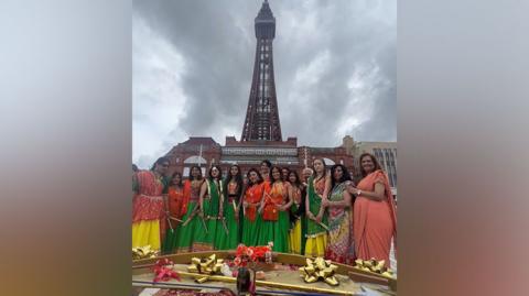 Fylde Coast Hindu Society's Bollywood dance group performing in front of Blackpool Tower