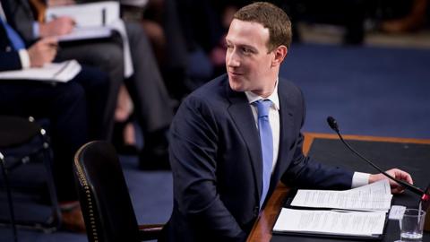 Mark Zuckerberg looking over his shoulder