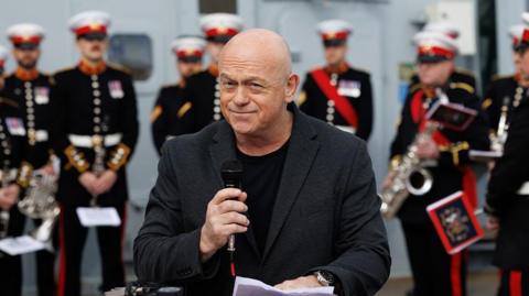 Ross Kemp joins school children and junior cadets during a 'street party' onboard the Royal Navy warship HMS Duncan at HM Naval Base on April 04, 2025 in Portsmouth, England. The Royal Navy Warship, HMS Duncan, hosts celebrities and schoolchildren onboard for a 'street party' to mark one month to go until the UK celebrates the 80th anniversary of the end of the Second World War in Europe.