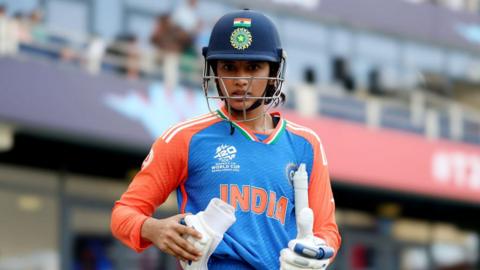 Smriti Mandhana of India looks on as she walks onto the pitch during the ICC Women's T20 World Cup 2024