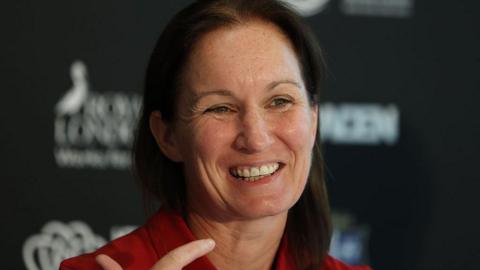 Jo Yapp smiles at a news conference