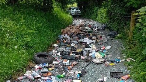 A large pile of waste blocking a country lane near Trefonen, in Shropshire