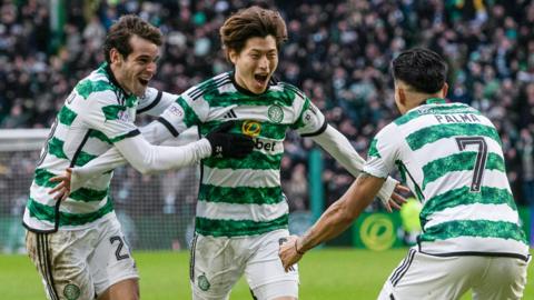 Celtic's Kyogo Furuhashi celebrates with Paulo Bernardo and Luis Palma after making it 2-0 during a Premiership match between Celtic and Rangers at Celtic Park