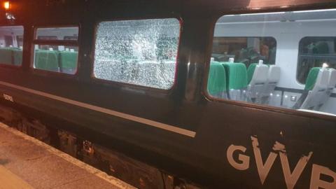 Shattered window on train