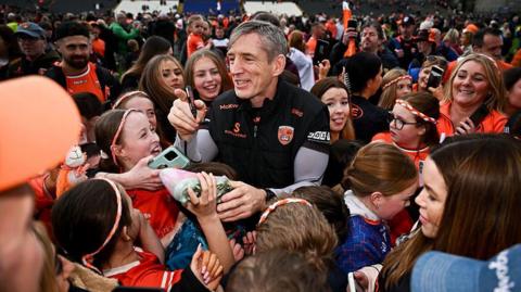 Kieran McGeeney mobbed at full-time