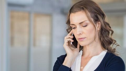 Woman on phone (posed)