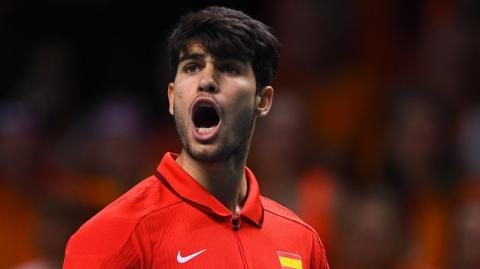 Carlos Alcaraz celebrates a point