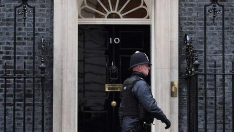 Police walking outside Downing Street