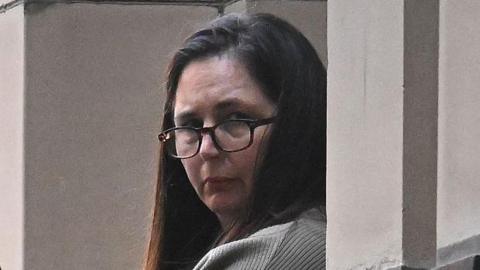 Erin Patterson during trial in Melbourne wearing glasses and her dark her down.