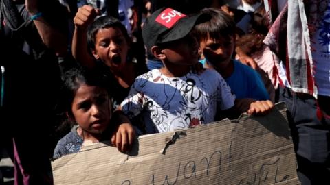 Refugees and migrants from the destroyed Moria camp protest after the news about the creation of a new temporary camp on the island of Lesbos, Greece, 11 September 2020