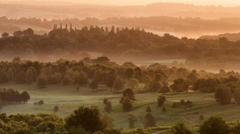 Sunrise looking over the weald of ashdown forest in sussex, UK