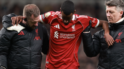 Alexander Isak is helped off the pitch after being injured while scoring for Liverpool in the Premier League win at Tottenham