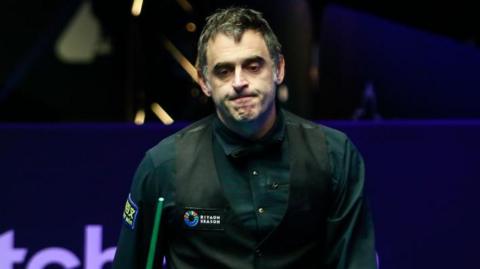 Seven-time world snooker champion Ronnie O'Sullivan ponders a shot