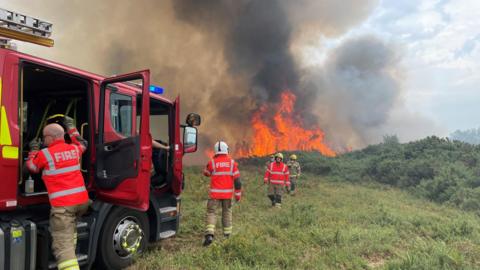 Firefighters at the scene of a fire