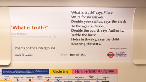 A close up of a advertising card in a Tube carriage with poem printed on it called What is Truth? by Louis Macneice.