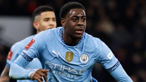 Divin Mubama in action for Manchester City