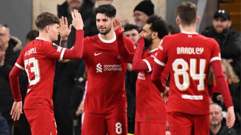 Liverpool players celebrate scoring a goal against Sparta Prague