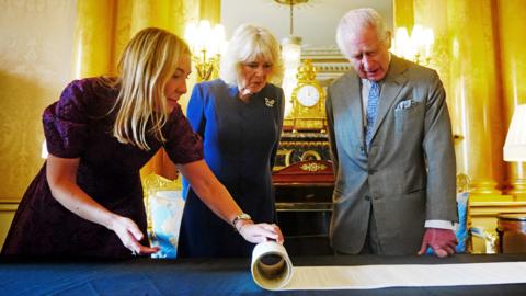 King Charles and Queen Camilla are presented with the Coronation Roll