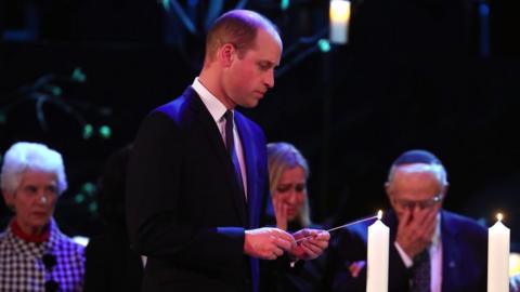 The Duke of Cambridge lights a candle during the UK Holocaust Memorial Day Commemorative Ceremony at Central Hall in Westminster, London