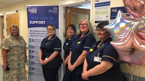 Nurses outside one of the new rooms