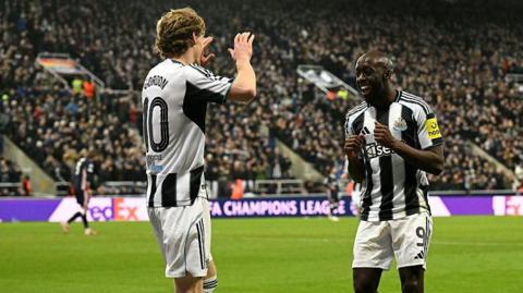 Anthony Gordon celebrates with Yoane Wissa after scoring for Newcastle United against PSV Eindhoven at St James' Park on 21 January, 2026