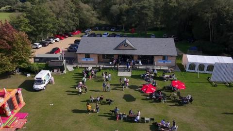 Newly rebuilt pavilion with crowds outside