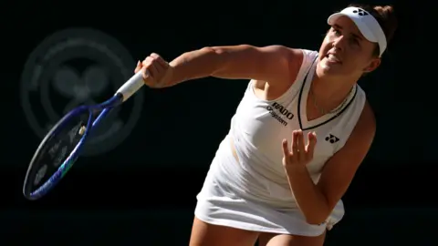 Karolina Muchova hits a forehand