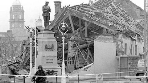 Solider in front of Remembrance Day bomb site