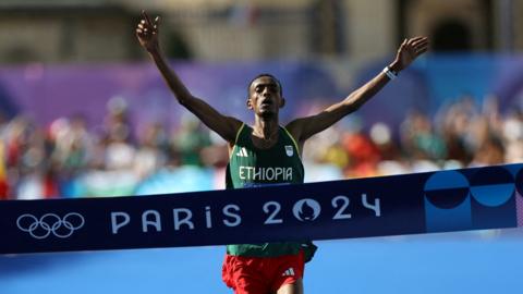 Tamirat Tola celebrates winning the Olympic marathon