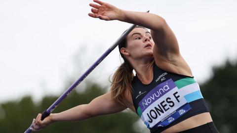 Freya Jones throwing a javelin