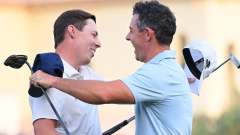 Matt Fitzpatrick and Rory McIlroy embrace after the Englishman defeated the Northern Irishman in a play-off to win the DP World Tour Championship.