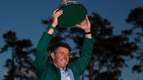 Rory McIlroy lifts the Masters trophy
