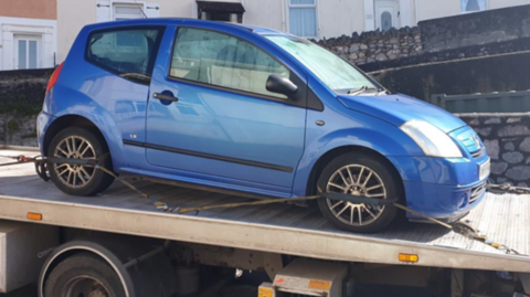 Blue car seized by police 