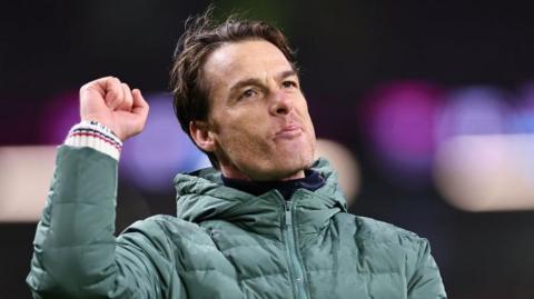 Burnley boss Scott Parker punching the air in celebration after his side's victory over Watford