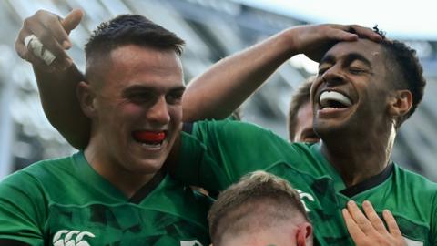 James Hume and Robert Baloucoune celebrate Baloucoune's try during their international debuts