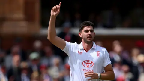 England fast bowler Josh Tongue celebrates taking a wicket