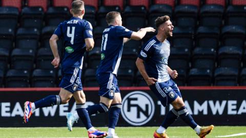 Queen's Park players celebrate