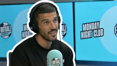 Conor Coady with Monday Night Club branded backdrop and microphone