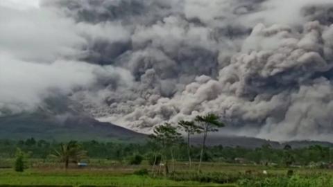 Huge clouds of ash rise from Mount Semeru