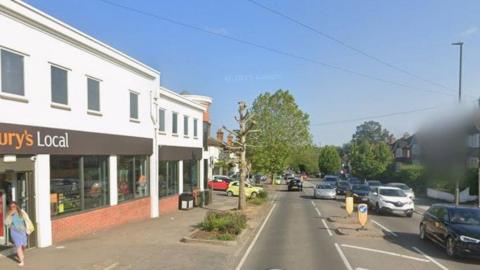 A google street view of Worplesdon Road, with a Sainsbury's Local on the right