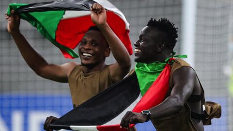 Sudan players celebrate qualifying for the Fifa Arab Cup