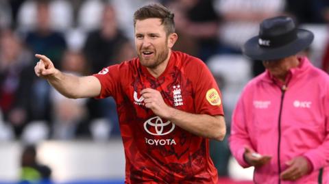 England spinner Liam Dawson celebrates taking a wicket