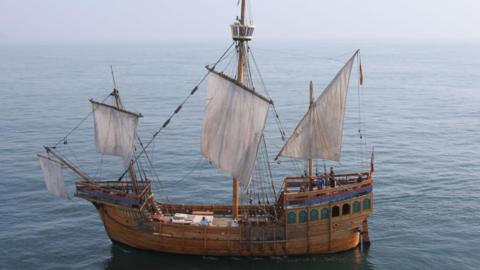 The Matthew, a Tudor wooden ship with four sails and rigging, sailing in the Bristol Channel.