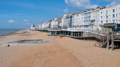 Hastings seafront, clear blue skies.