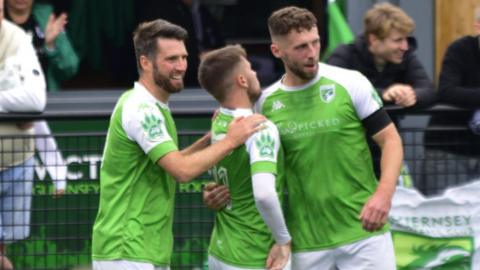 Guernsey FC celebrate scoring a goal